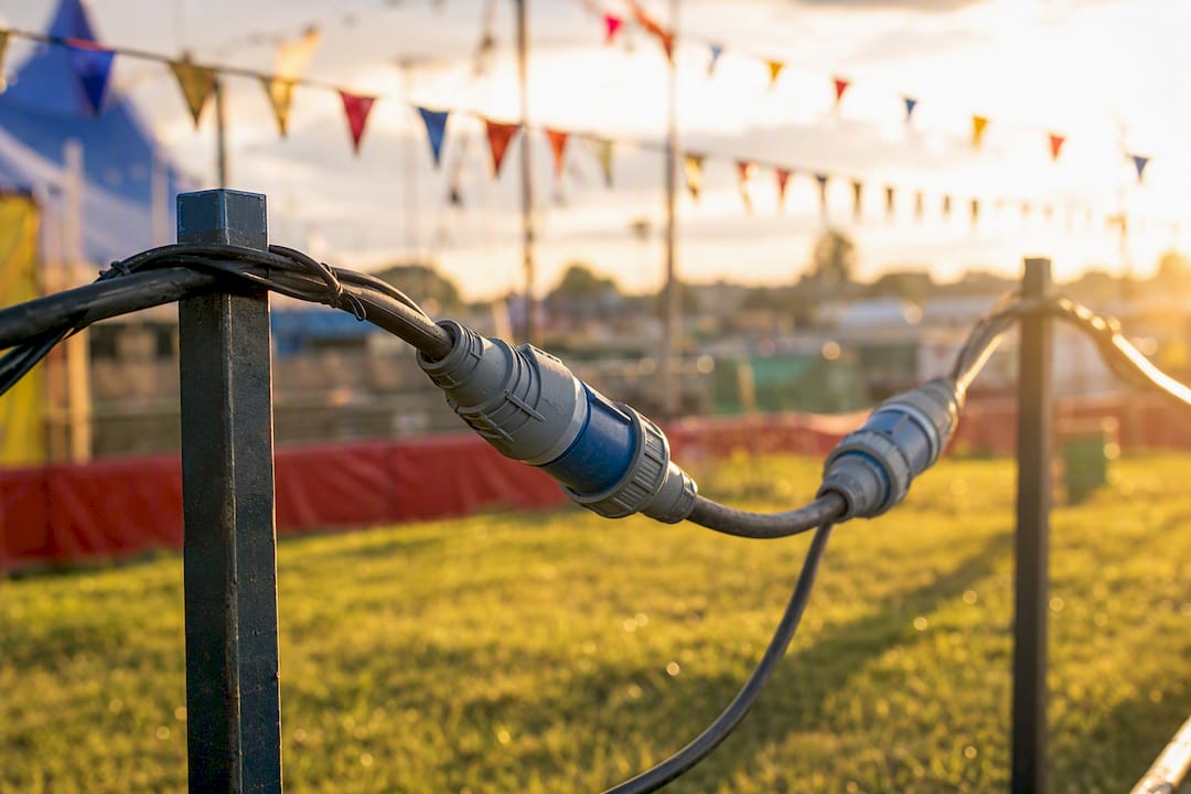 Outdoor lighting cables with industrial waterproof connectors overhead