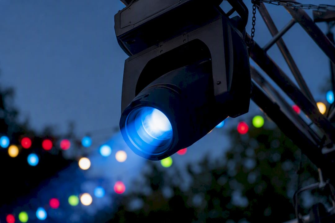 Outdoor moving head lighting fixture in action