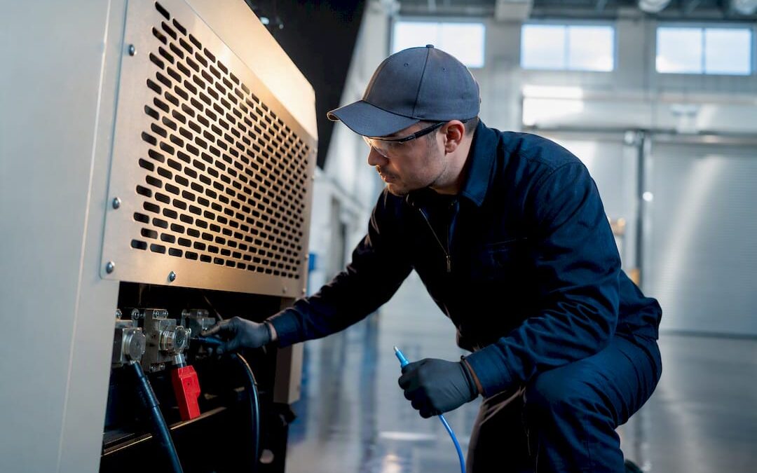 Technician inspecting load bank during generator test
