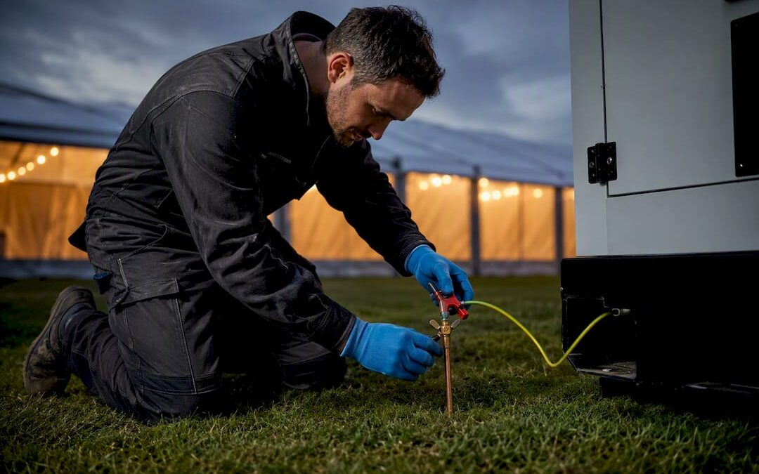 Electrician connecting marquee generator earth electrode