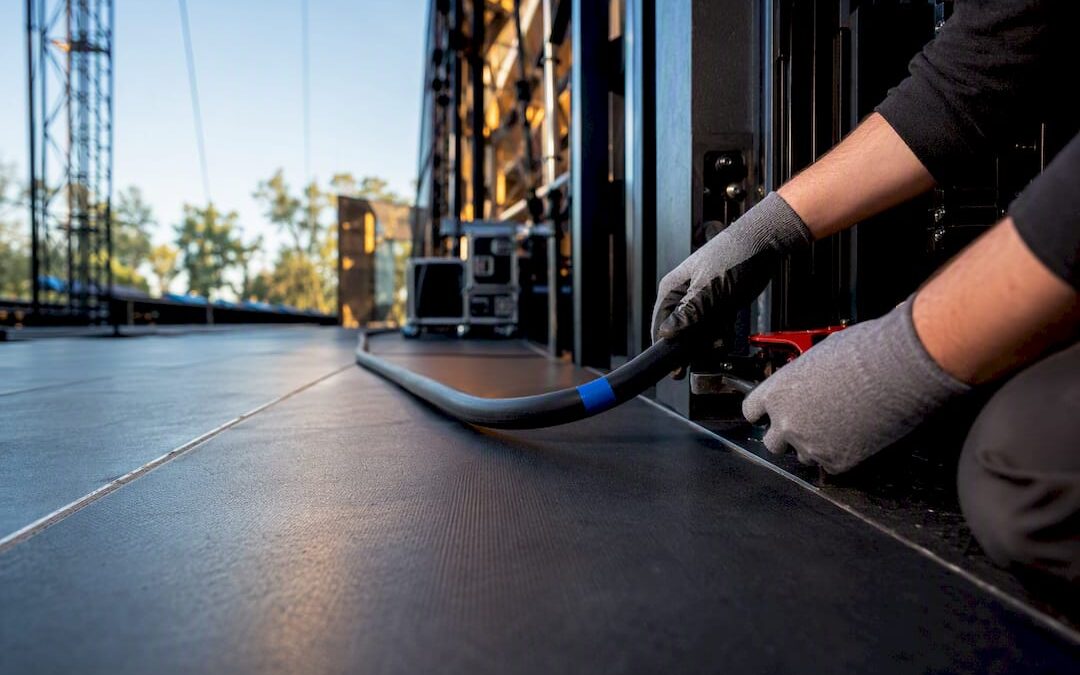Installer checking temporary generator feeder cable